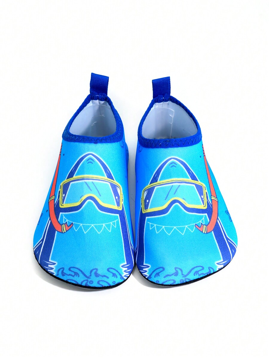 Multicolor cartoon pattern boys' aqua socks with breathable polyester upper, slip-on closure, and non-slip TPR outsole.