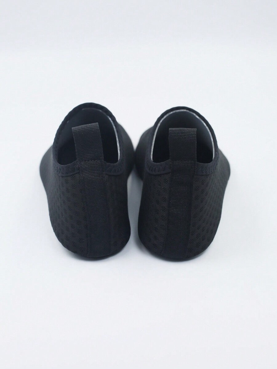 Kids slip-on aqua socks featuring geometric pattern, breathable Lycra upper, and non-slip TPR outsole for beach and water activities.