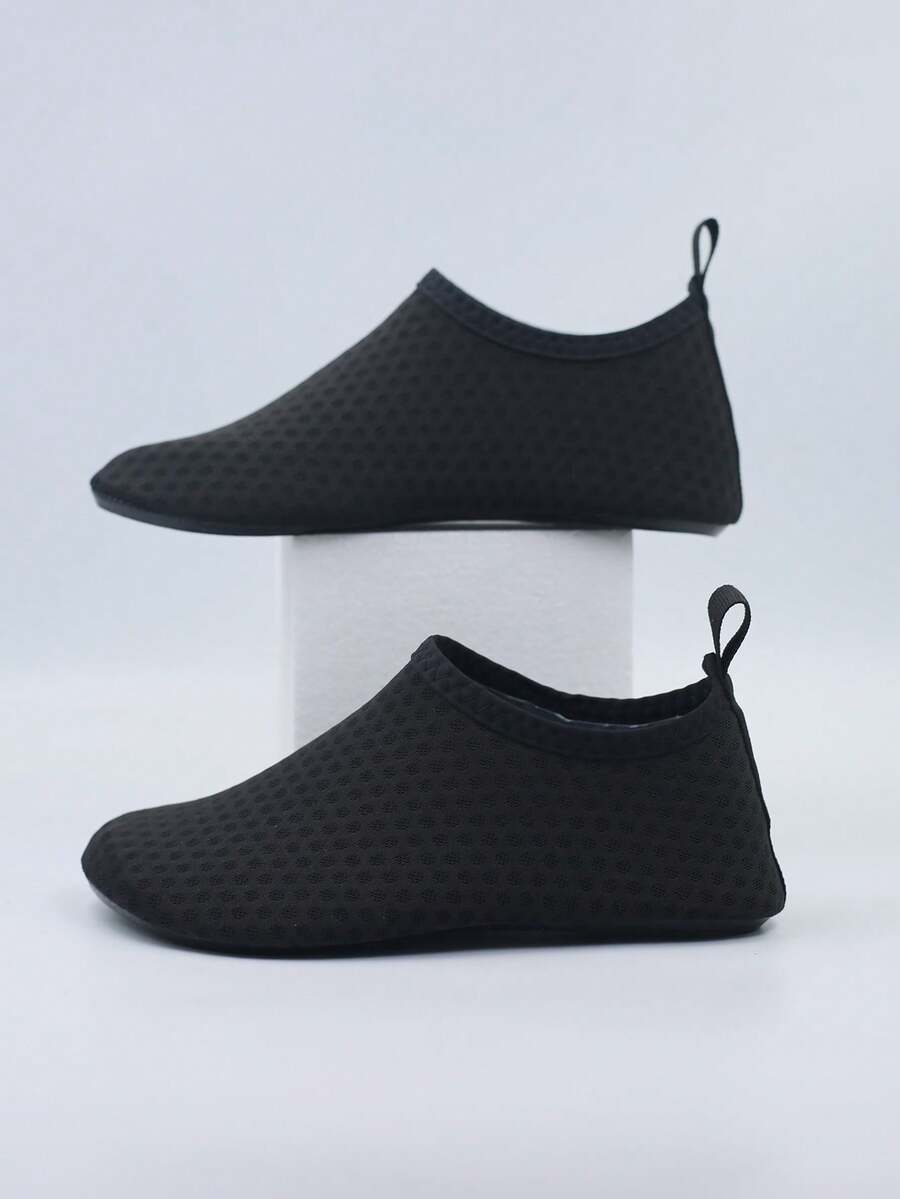 Kids slip-on aqua socks featuring geometric pattern, breathable Lycra upper, and non-slip TPR outsole for beach and water activities.