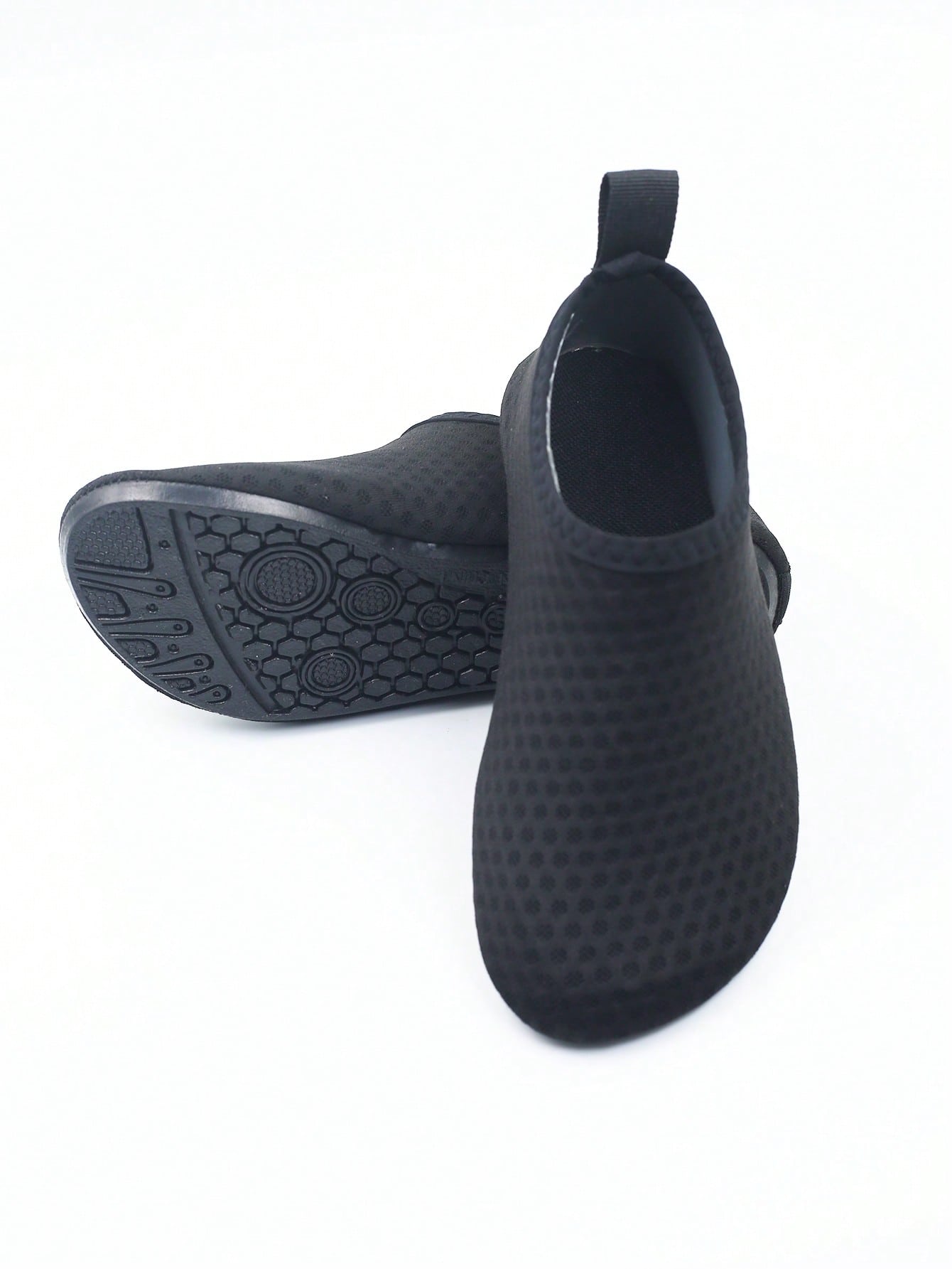 Pair of black kids water shoes with breathable Lycra upper and non-slip rubber sole for boys and girls.