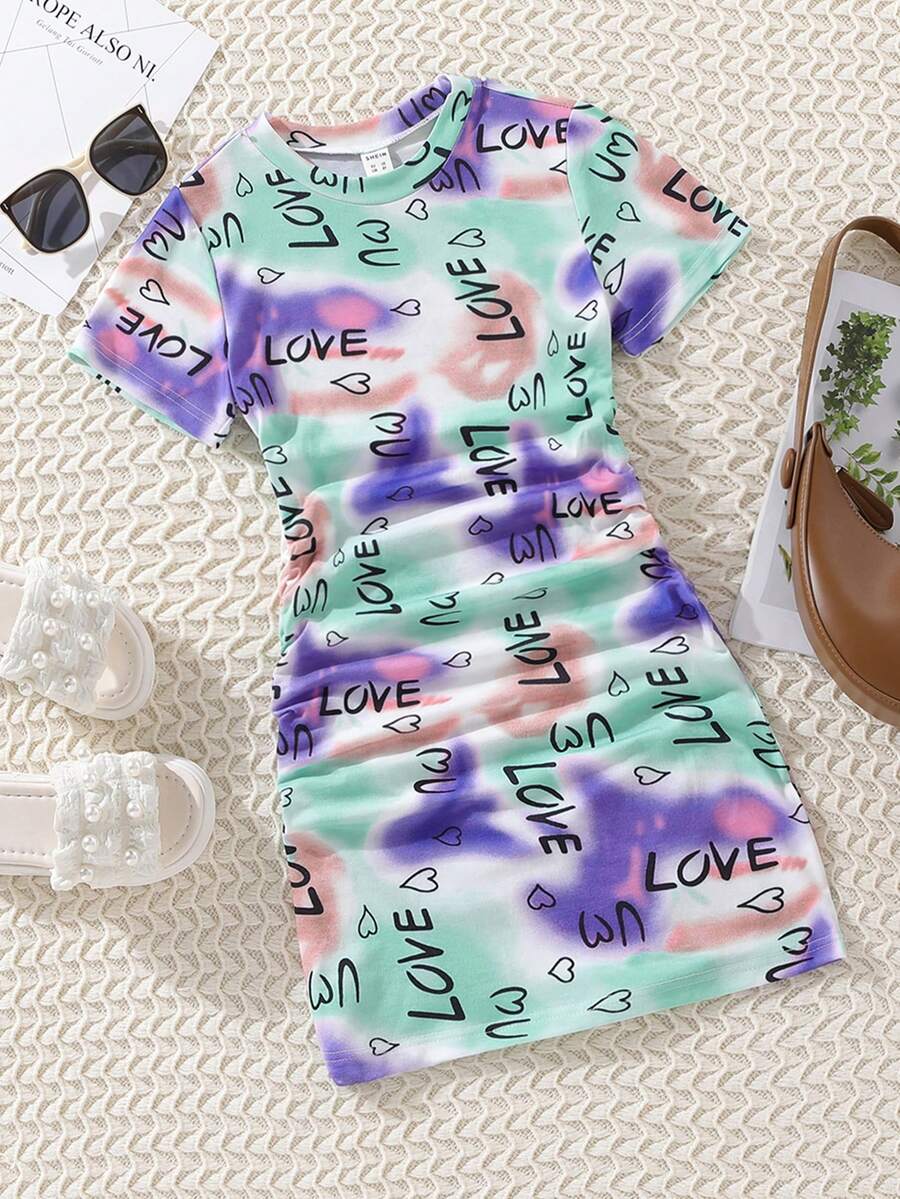 Tween girls multicolor tie dye short sleeve tee mini dress featuring ruched sides, round neck, and slim fit design.