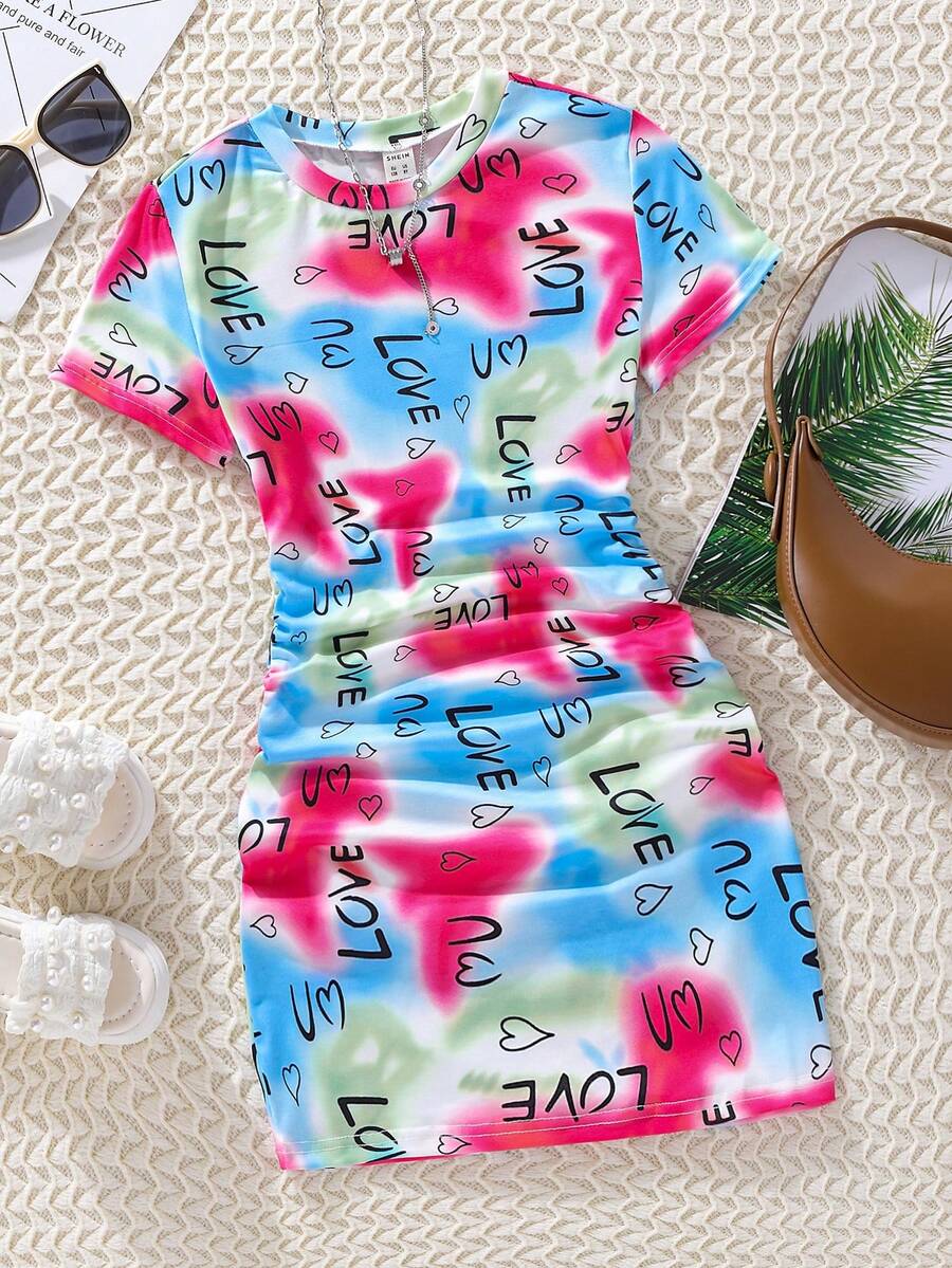 Tween girls multicolor tie dye short sleeve tee mini dress featuring ruched sides, round neck, and slim fit design.