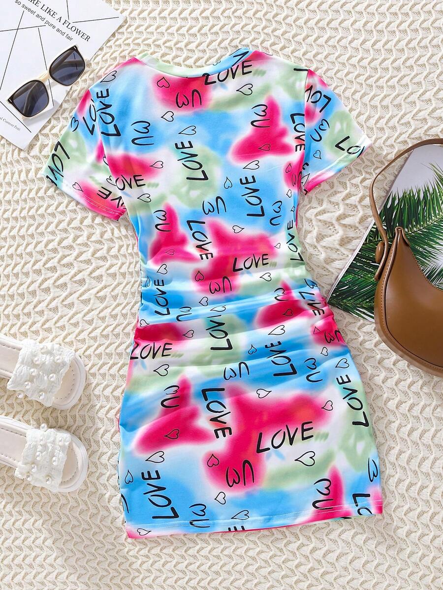 Tween girls multicolor tie dye short sleeve tee mini dress featuring ruched sides, round neck, and slim fit design.