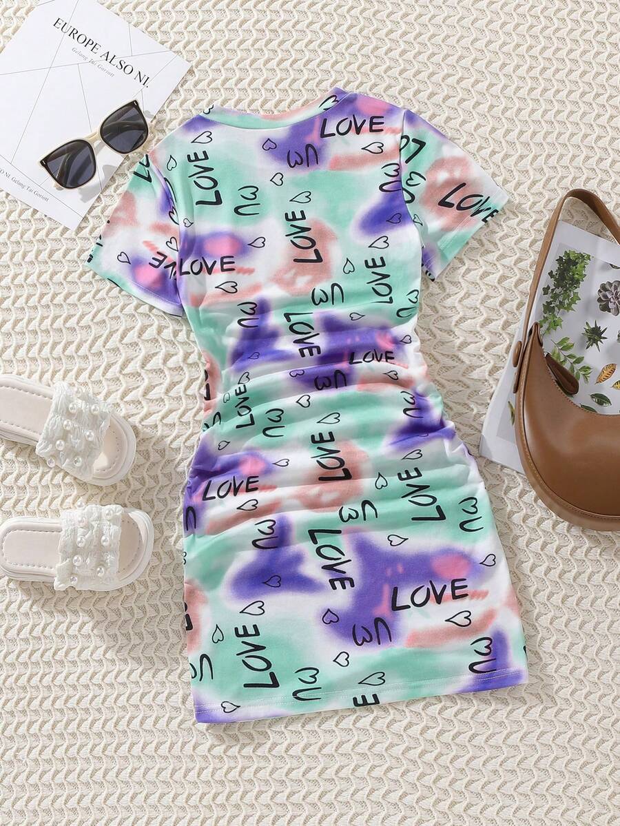 Tween girls multicolor tie dye short sleeve tee mini dress featuring ruched sides, round neck, and slim fit design.