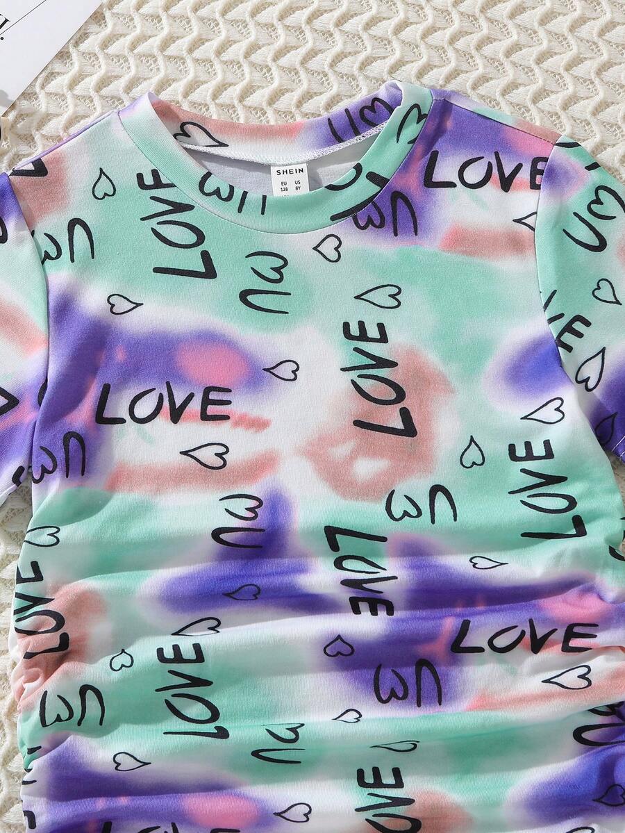 Tween girls multicolor tie dye short sleeve tee mini dress featuring ruched sides, round neck, and slim fit design.