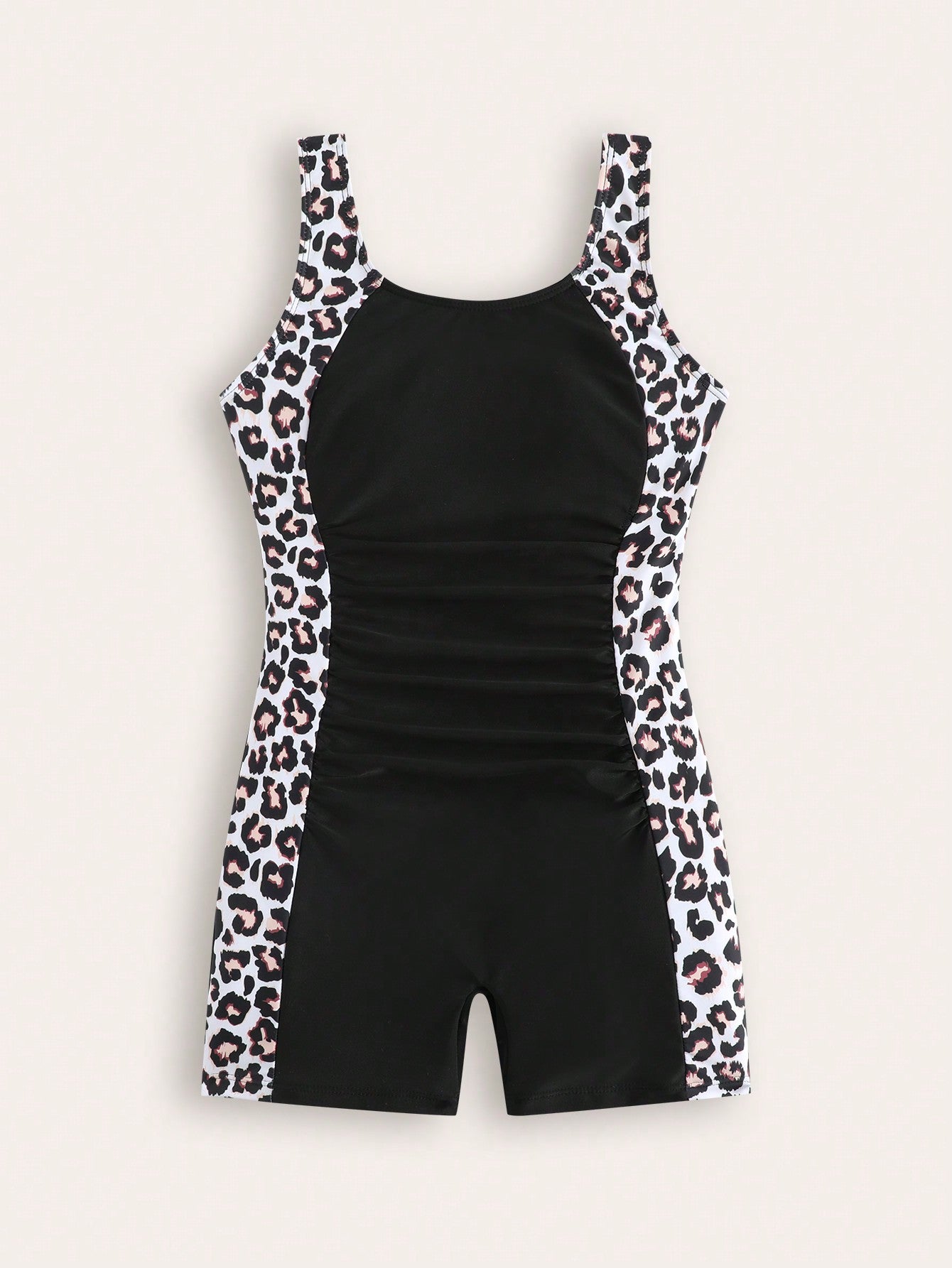 Tween girls one-piece swimsuit with scoop neck, contrast piping, short length, and shorts bottom for summer beach and vacation wear