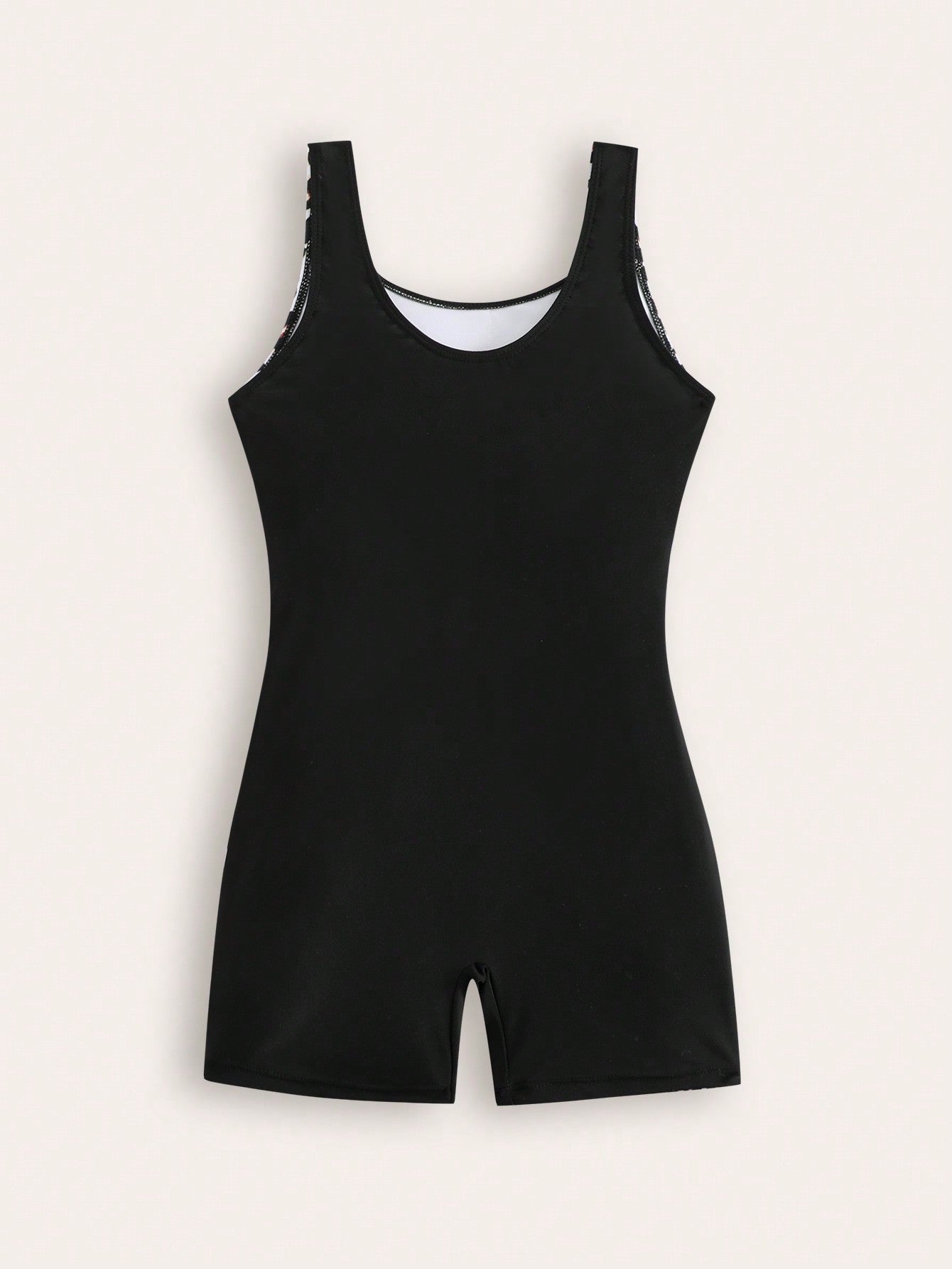 Tween girls one-piece swimsuit with scoop neck, contrast piping, short length, and shorts bottom for summer beach and vacation wear