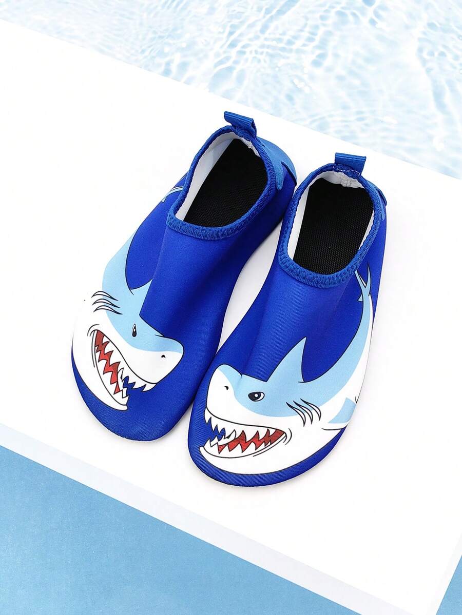 Boys blue shark pattern water shoes with breathable fabric upper and soft bottom TPR outsole.