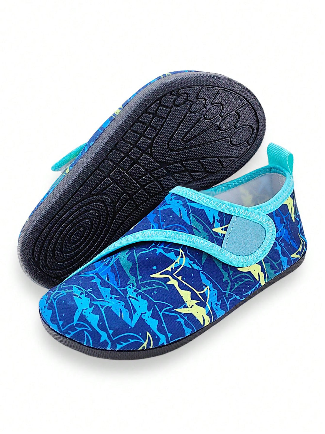 Blue kids water shoes with a shark print pattern, breathable fabric upper, and secure hook and loop closure.
