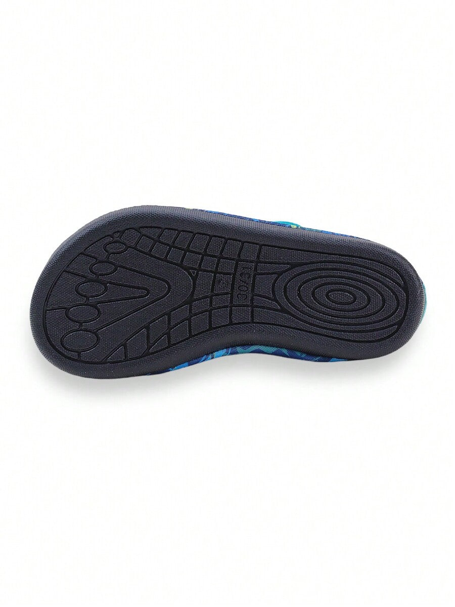 Blue kids water shoes with a shark print pattern, breathable fabric upper, and secure hook and loop closure.