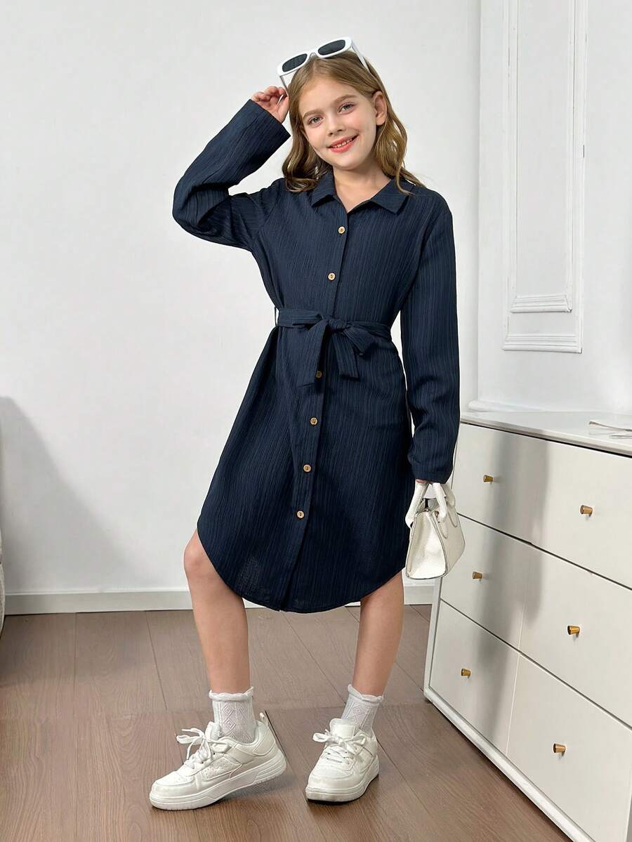 Royal blue tween girls polo collar midi shirt dress with long sleeves, a waist belt, and front button details.