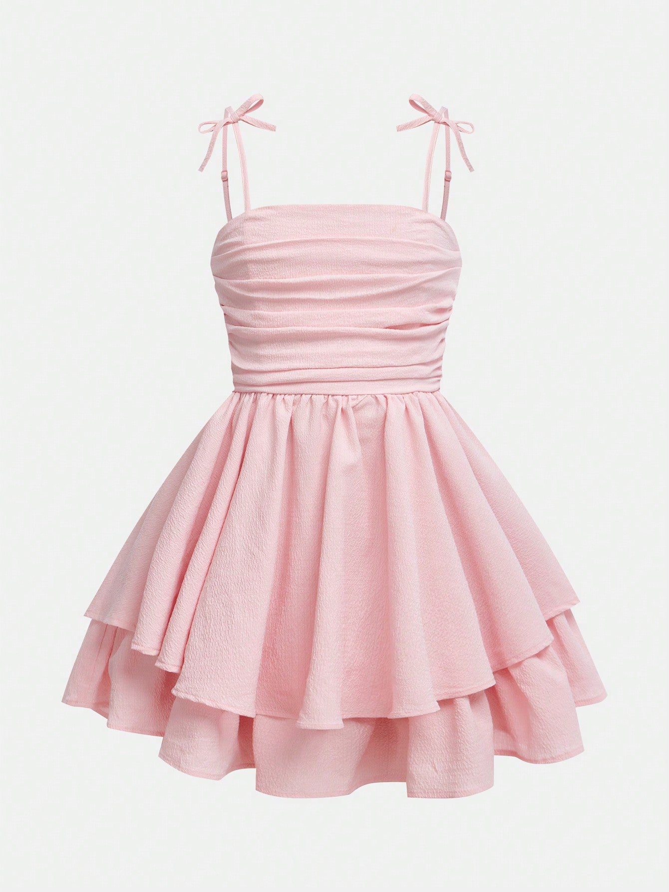 Tween girls apricot tiered cami dress with spaghetti straps, high waist, and slim fit layered hem.