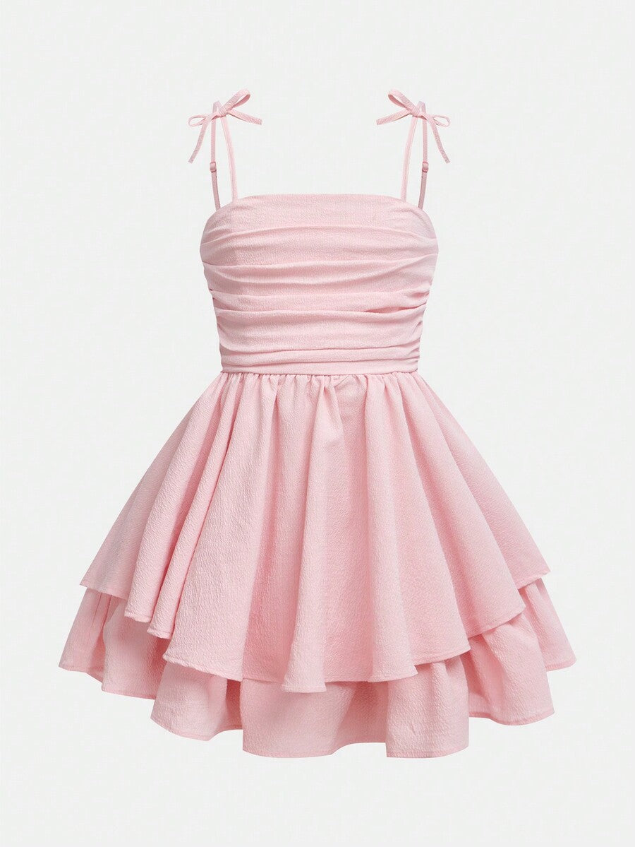 Tween girls apricot tiered cami dress with spaghetti straps, high waist, and slim fit layered hem.