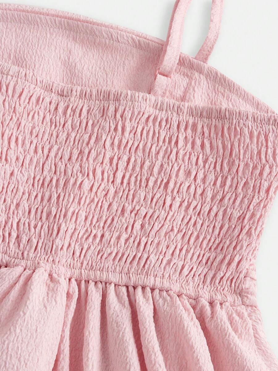 Tween girls apricot tiered cami dress with spaghetti straps, high waist, and slim fit layered hem.