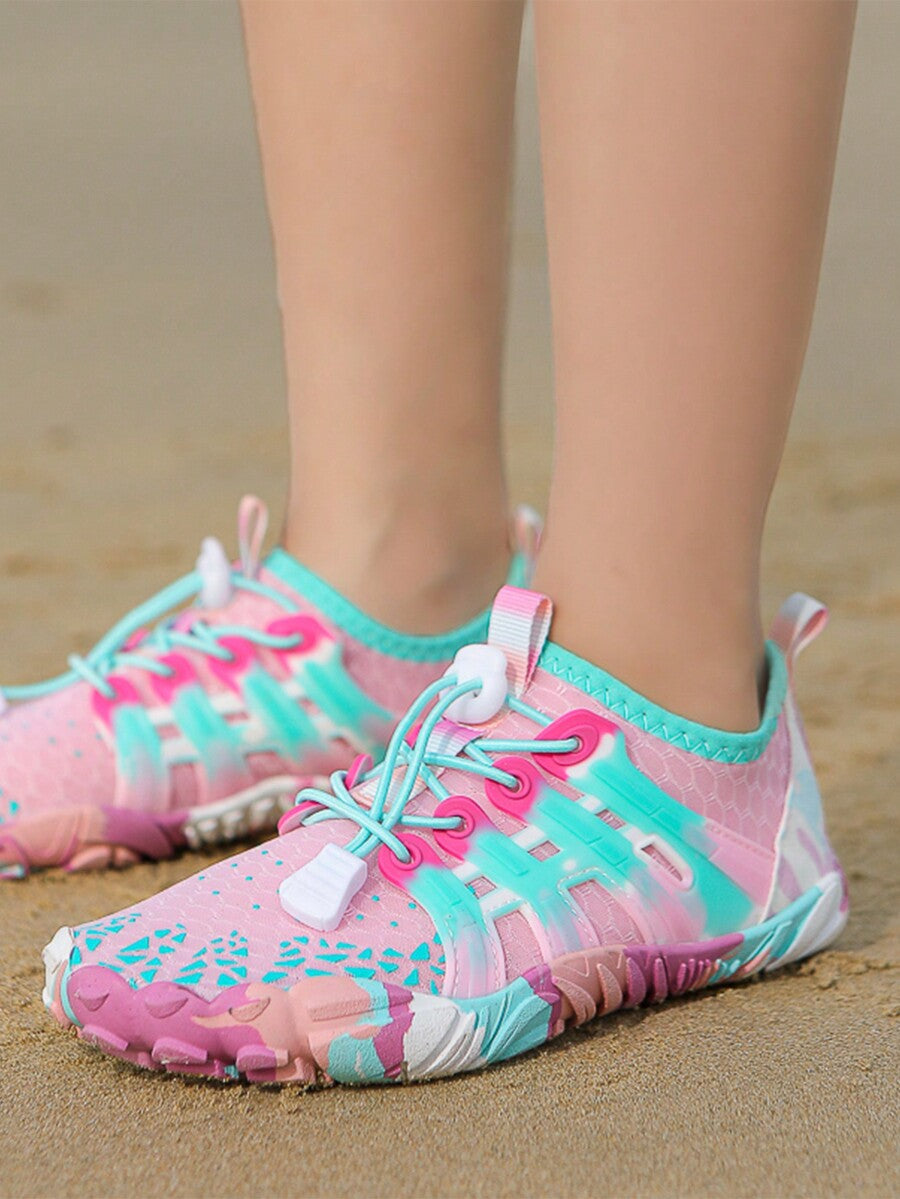 Girls purple quick-drying water shoes featuring a geometric pattern, slip-on fit with lace-up detail, and rubber outsole.
