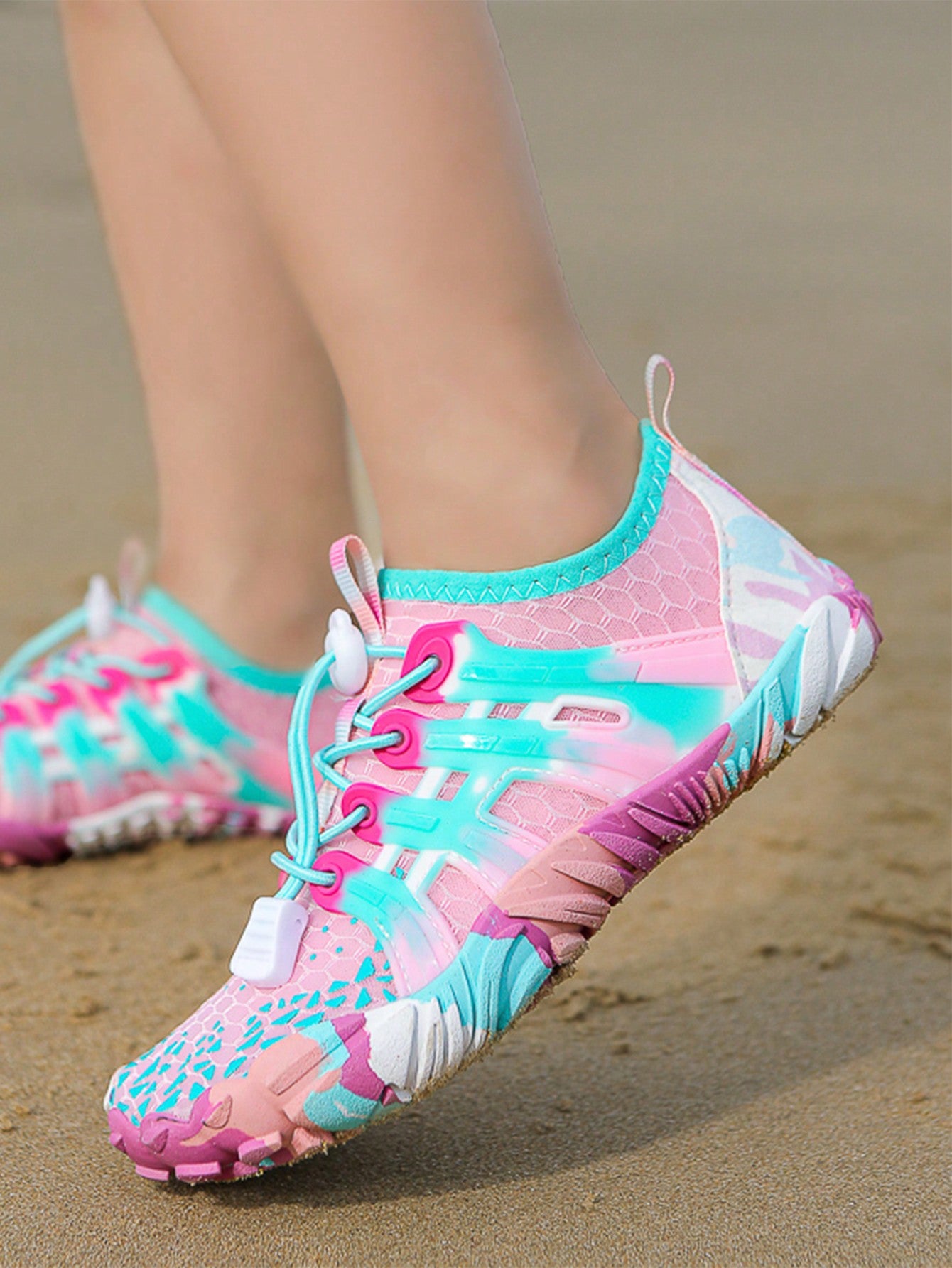 Girls purple quick-drying water shoes featuring a geometric pattern, slip-on fit with lace-up detail, and rubber outsole.