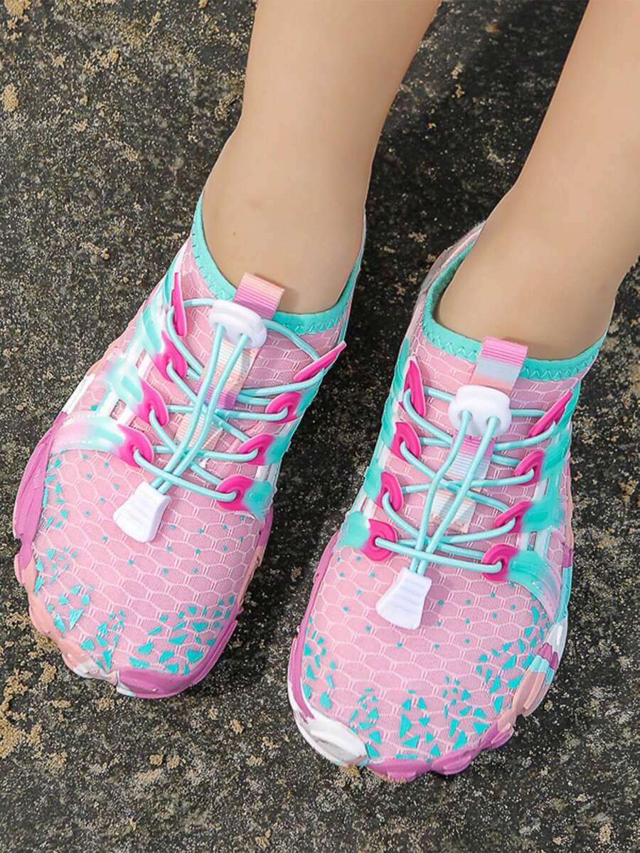 Girls purple quick-drying water shoes featuring a geometric pattern, slip-on fit with lace-up detail, and rubber outsole.