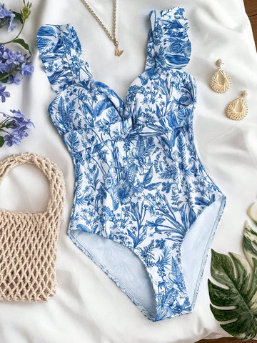 Tween girls blue and white floral print one-piece swimsuit with ruffle detail, spaghetti straps, V-neck styling, and vacation beachwear look.