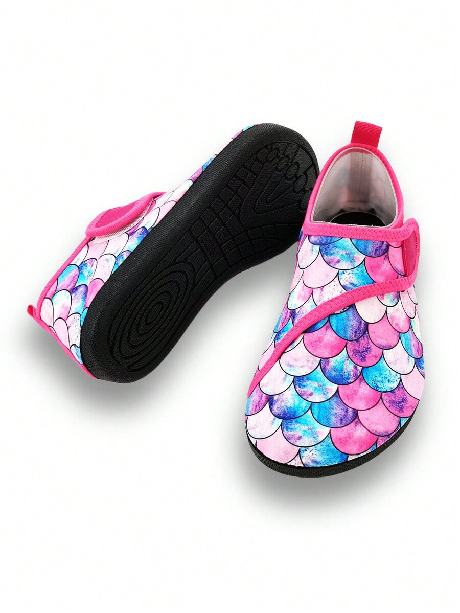 Blue kids water shoes with a shark print pattern, breathable fabric upper, and secure hook and loop closure.