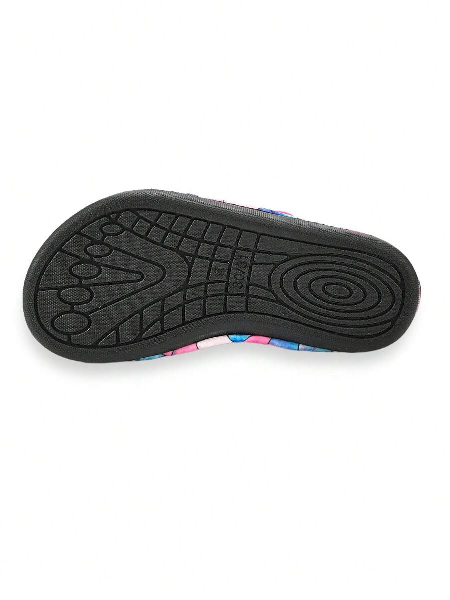 Blue kids water shoes with a shark print pattern, breathable fabric upper, and secure hook and loop closure.