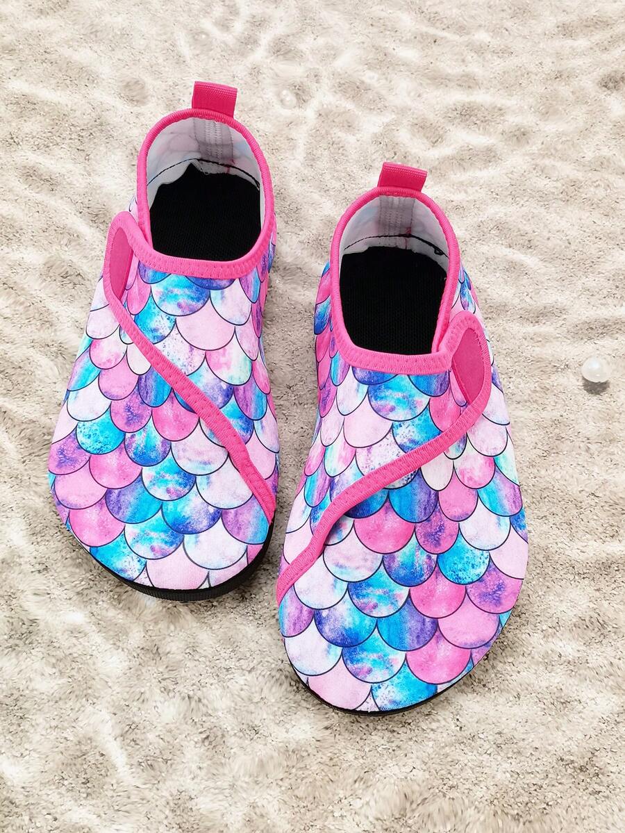 Blue kids water shoes with a shark print pattern, breathable fabric upper, and secure hook and loop closure.