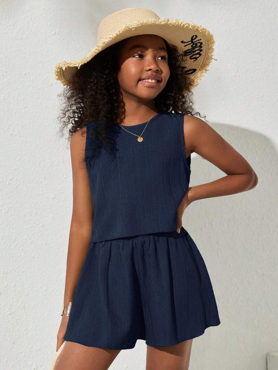 Tween girls army green casual outfit featuring a sleeveless round neck top with button details paired with matching woven loose shorts.