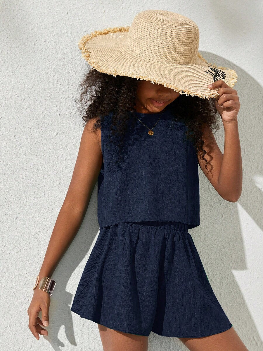 Tween girls army green casual outfit featuring a sleeveless round neck top with button details paired with matching woven loose shorts.