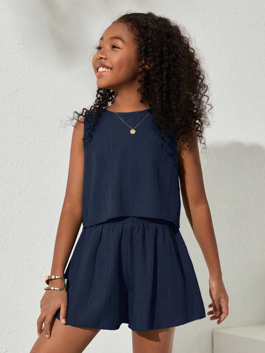 Tween girls army green casual outfit featuring a sleeveless round neck top with button details paired with matching woven loose shorts.