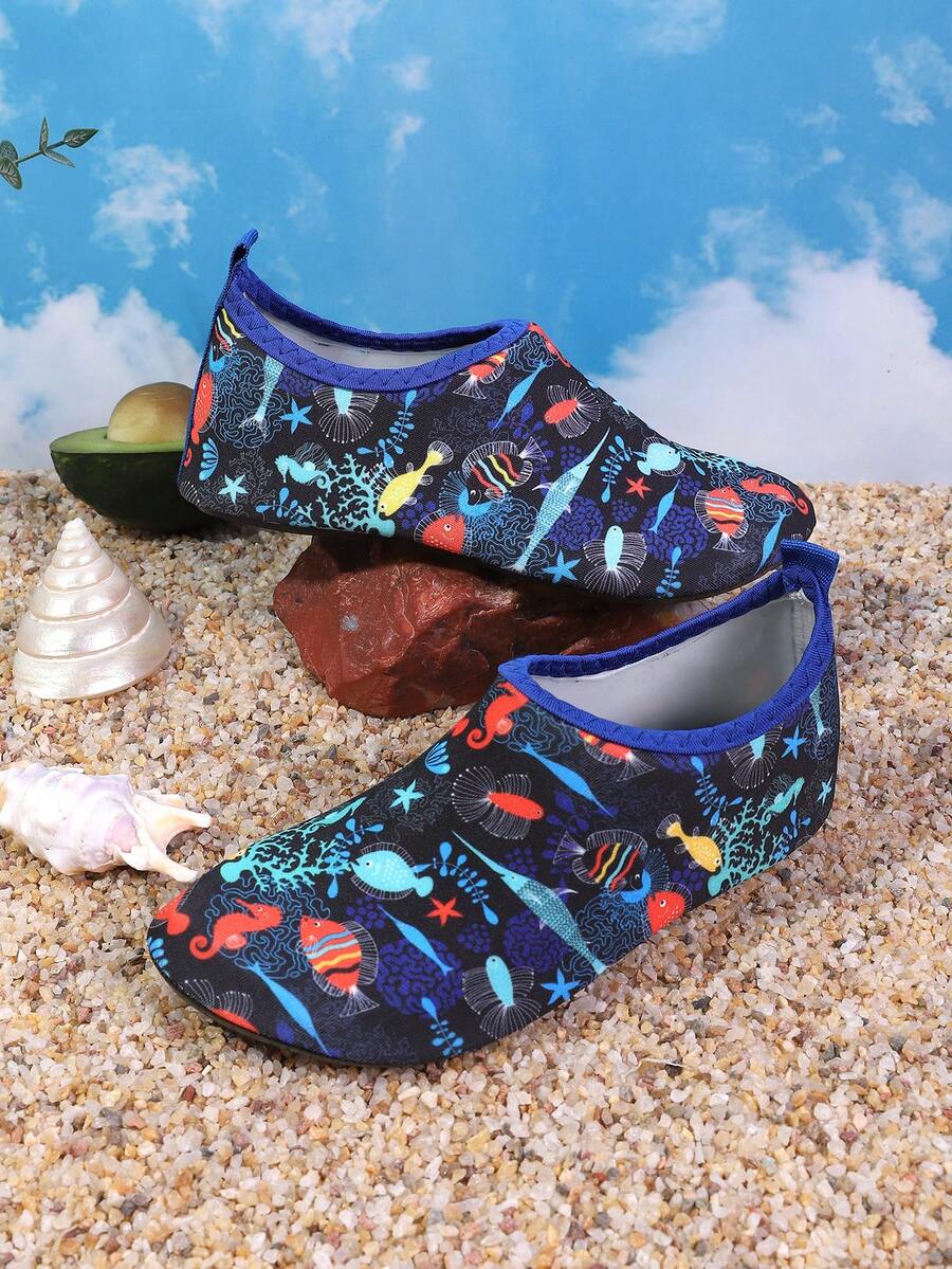 Pair of lightweight slip-on kids water shoes with breathable upper and non-slip outsole for summer beach and pool wear.