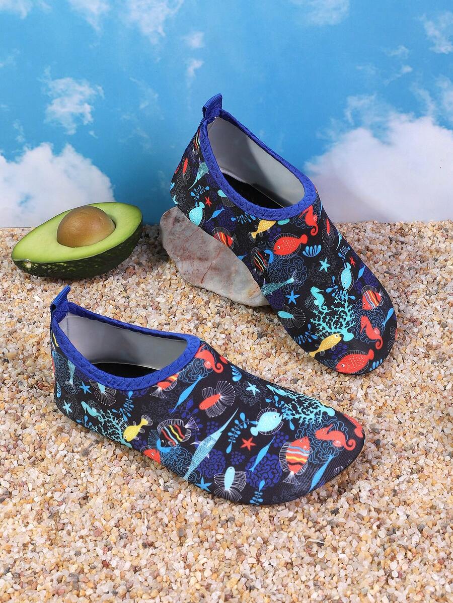 Pair of lightweight slip-on kids water shoes with breathable upper and non-slip outsole for summer beach and pool wear.