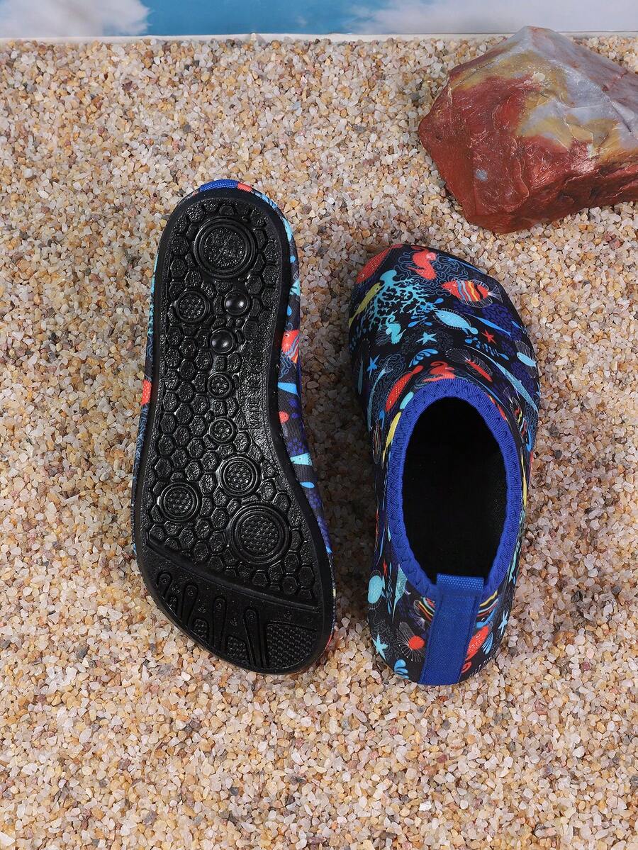 Pair of lightweight slip-on kids water shoes with breathable upper and non-slip outsole for summer beach and pool wear.