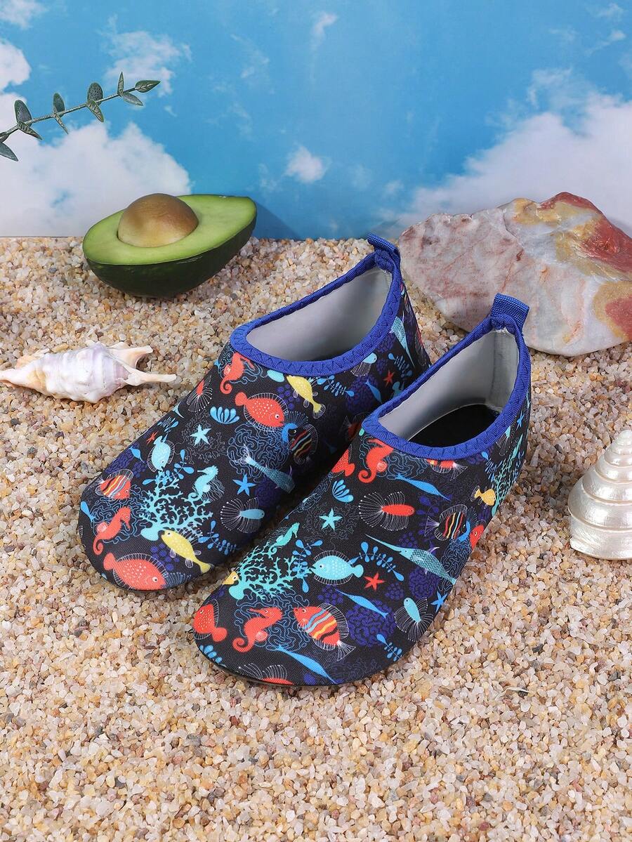 Pair of lightweight slip-on kids water shoes with breathable upper and non-slip outsole for summer beach and pool wear.