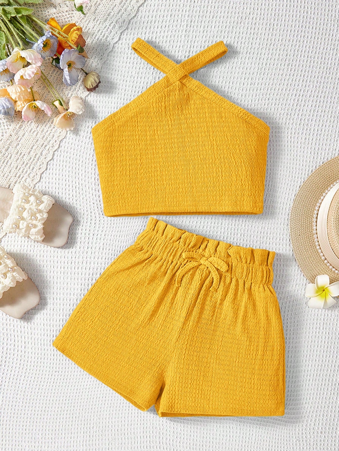 Tween girl 2-piece casual outfit set featuring a solid beige knit halter sleeveless top with belted detail and matching shorts.