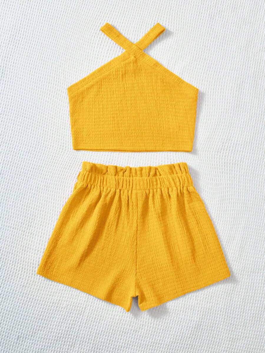 Tween girl 2-piece casual outfit set featuring a solid beige knit halter sleeveless top with belted detail and matching shorts.
