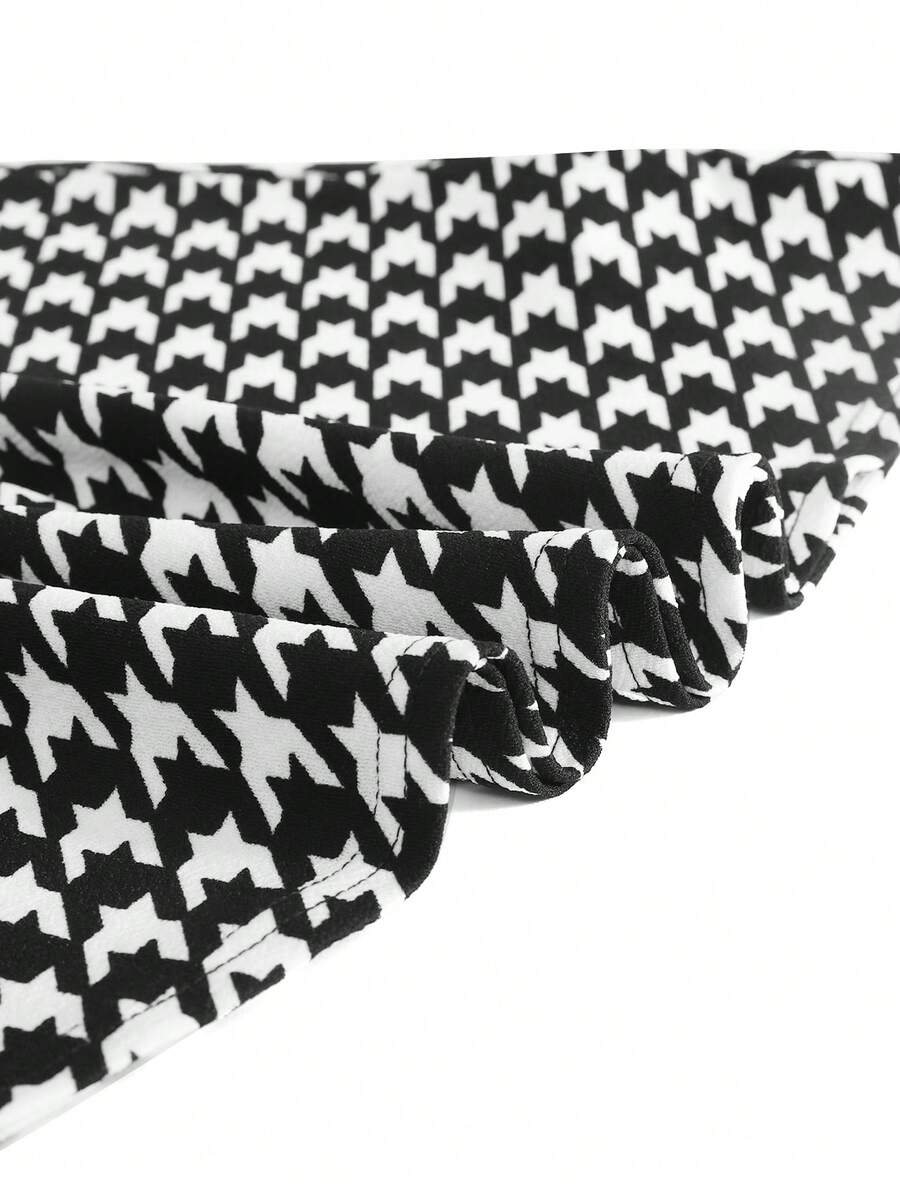 Nova Glow tween girls black and white houndstooth print short sleeve A-line dress with decorative buttons and crew neckline.
