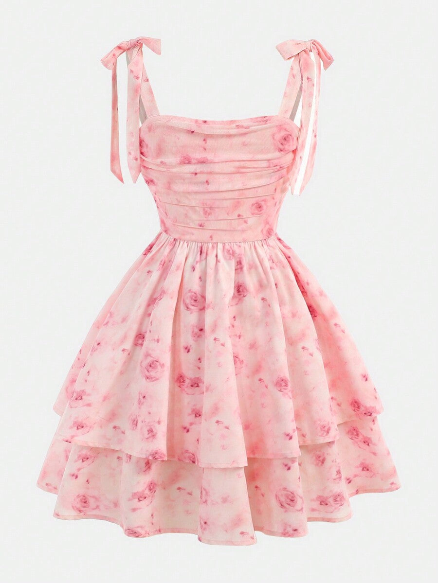 Tween girl wearing a pink tiered off-the-shoulder midi dress with shirred high waist and layered hem