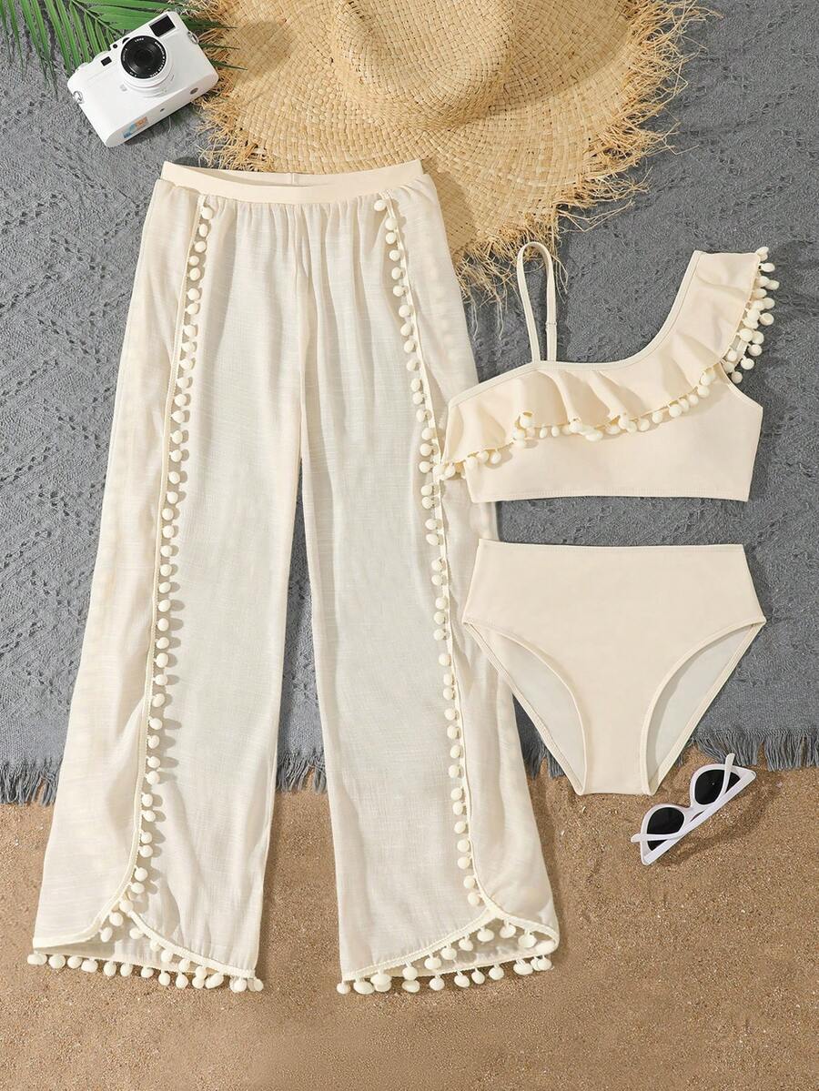 Beige 3-piece swimwear set for tween girls featuring an asymmetrical ruffle top with contrast lace trim, plant pattern, and mid-waist bikini bottoms.