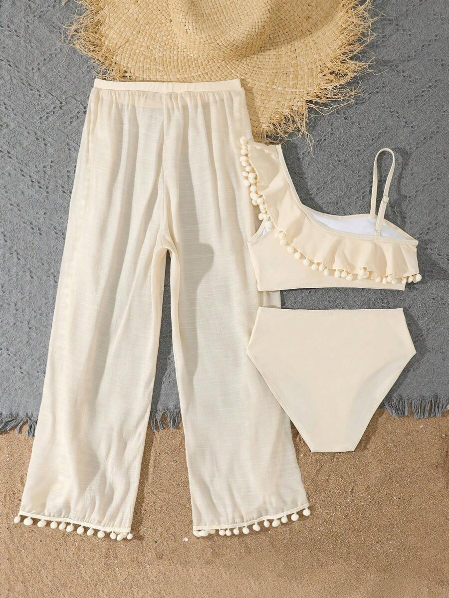 Beige 3-piece swimwear set for tween girls featuring an asymmetrical ruffle top with contrast lace trim, plant pattern, and mid-waist bikini bottoms.