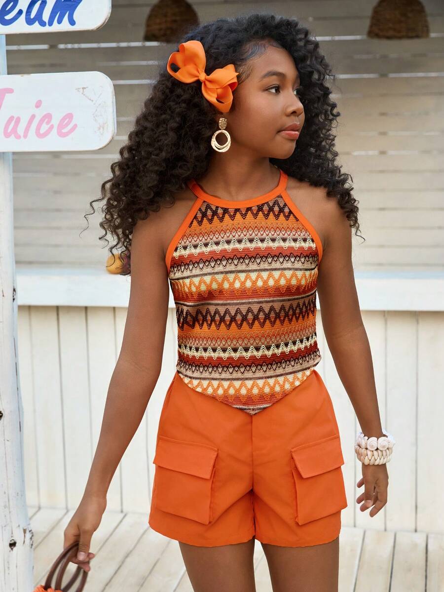 Girls 2-piece vacation outfit set with sleeveless halter knit crop top and graphic cargo shorts.