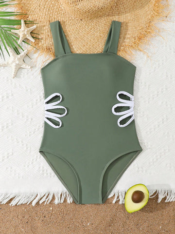 Tween girls purple one-piece swimsuit with strap neckline, cut-out detail, plain vacation style, wireless bra, and mid-waist bottom