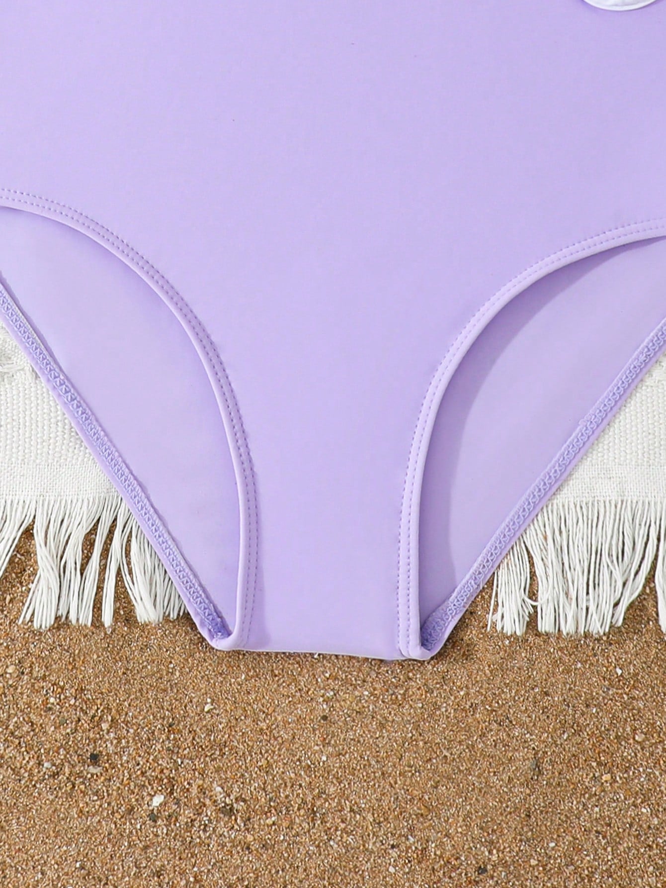 Tween girls purple one-piece swimsuit with strap neckline, cut-out detail, plain vacation style, wireless bra, and mid-waist bottom