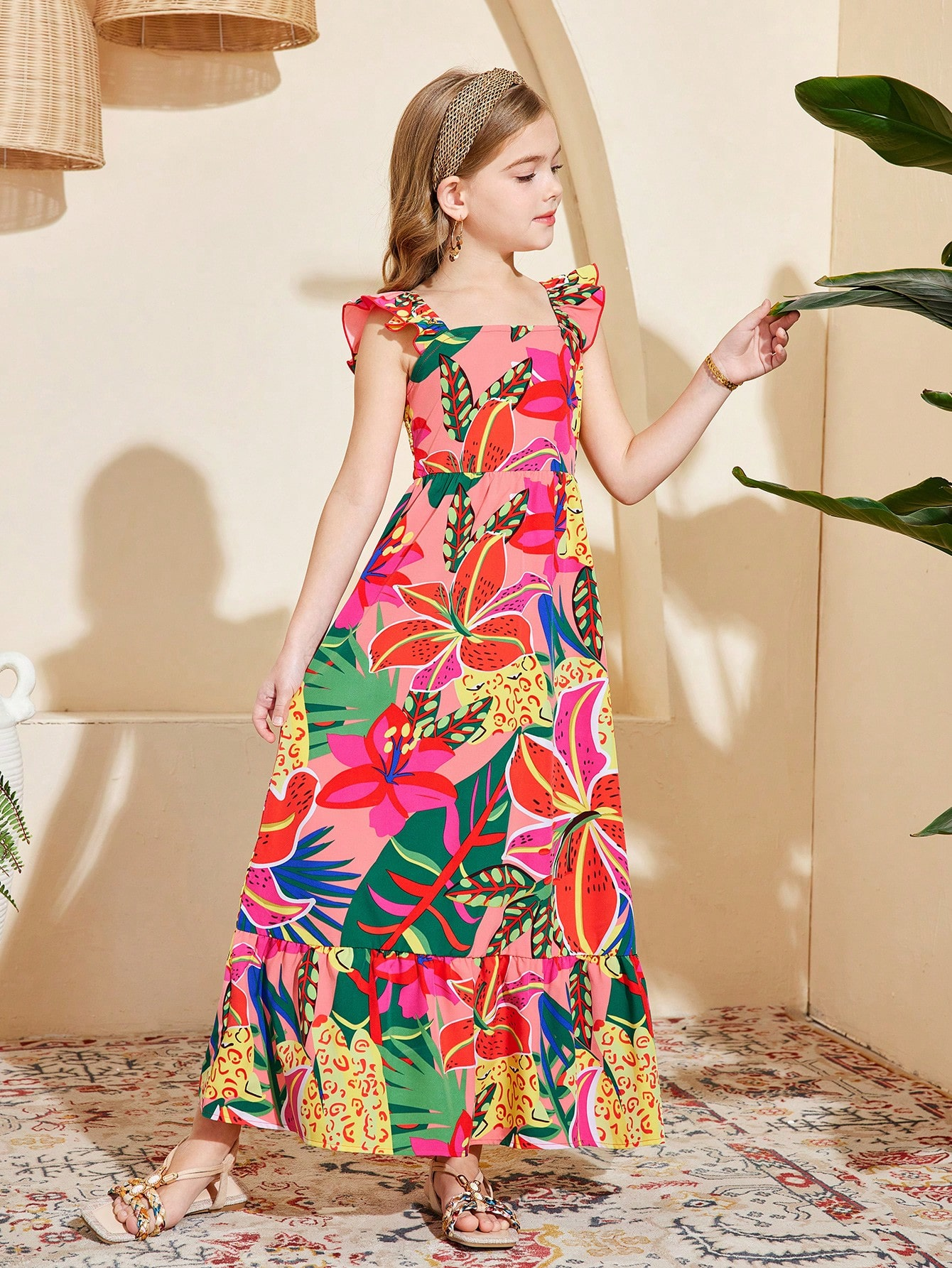 Tween girl multicolor floral vacation dress with square neck, ruffle details, shirred bodice, sleeveless A-line shape, high waist, and flounce hem.