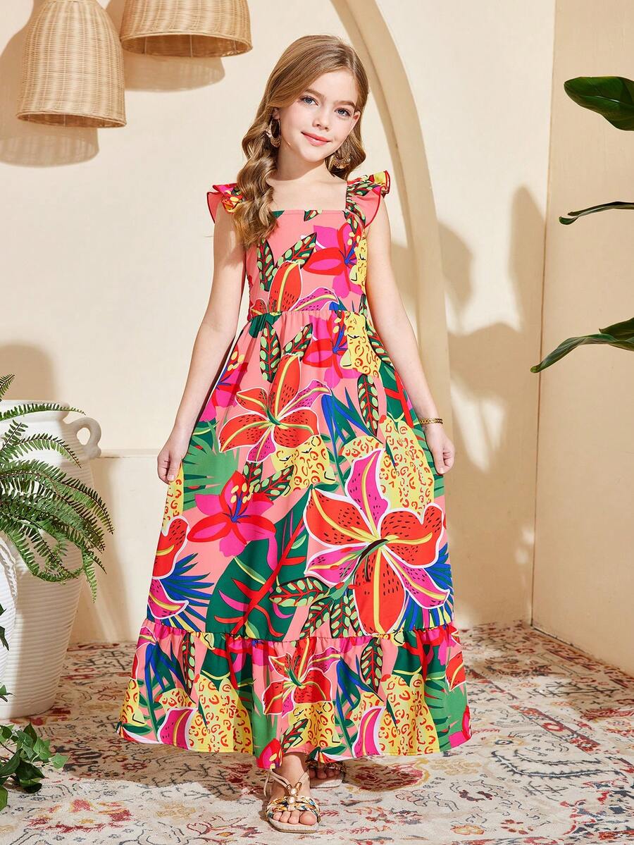 Blue floral print long vacation dress for tween girls featuring an A-line high waist silhouette with ruffle details and spaghetti straps.