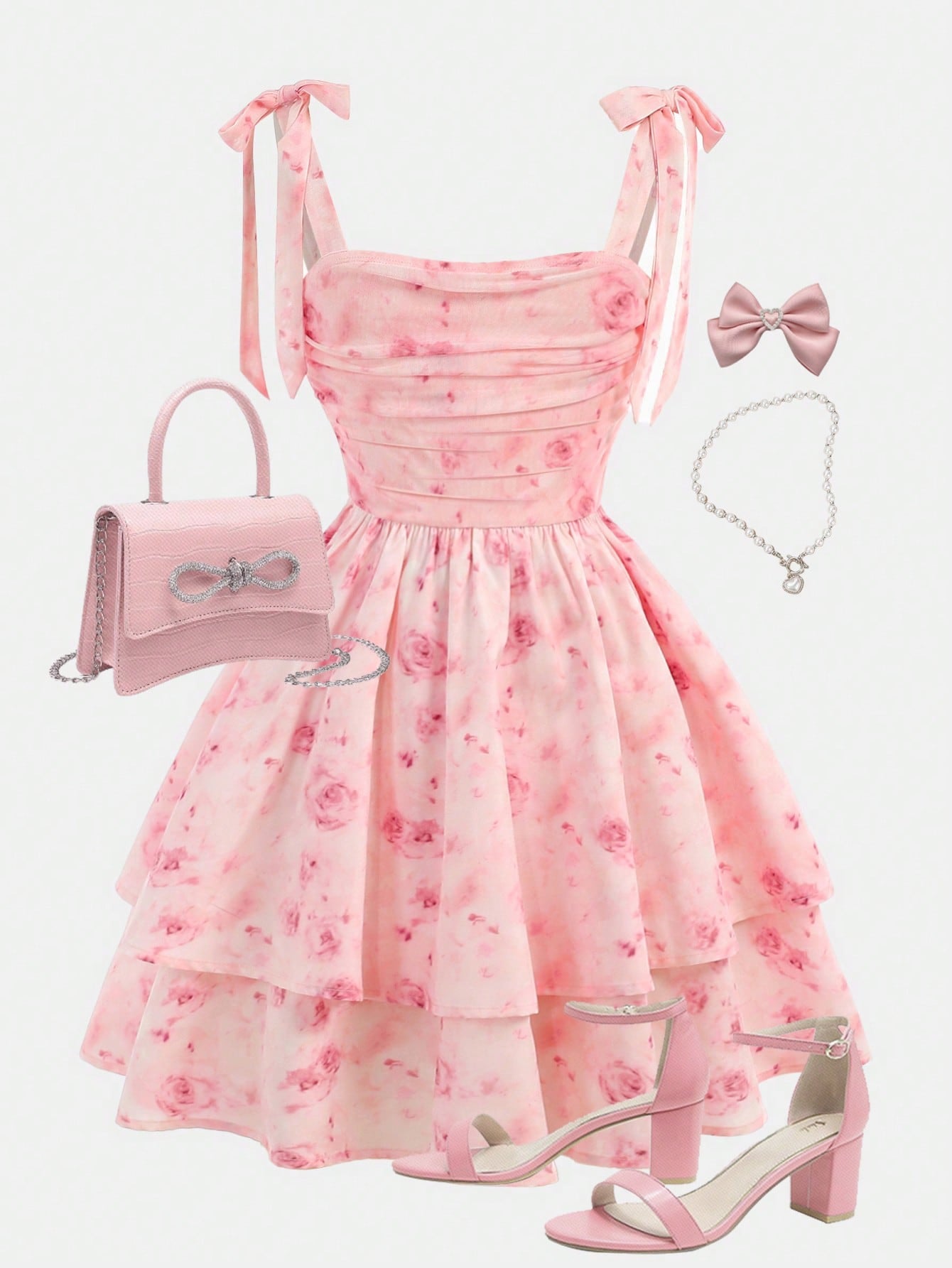 Tween girl wearing a pink tiered off-the-shoulder midi dress with shirred high waist and layered hem