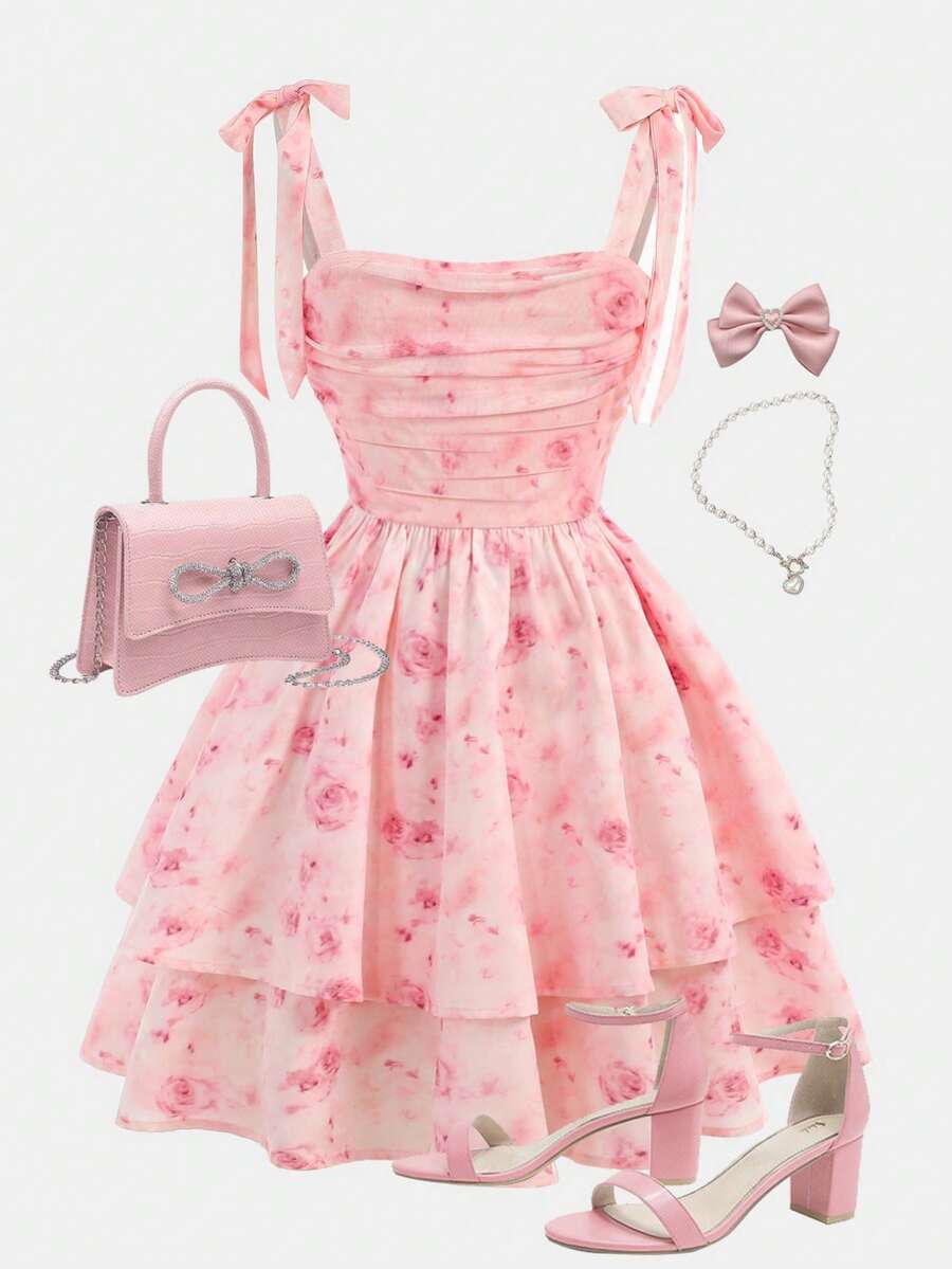 Tween girl wearing a pink tiered off-the-shoulder midi dress with shirred high waist and layered hem