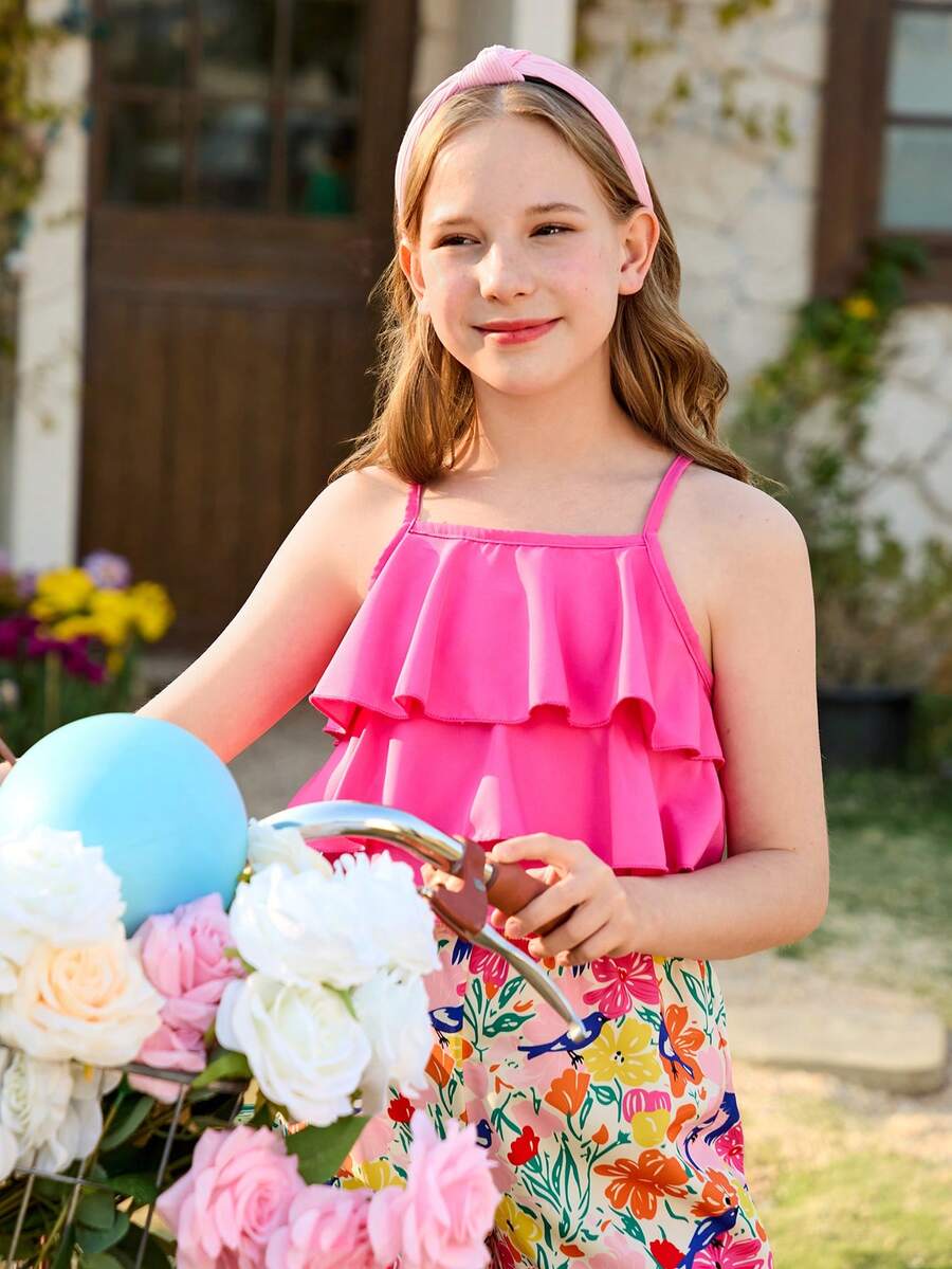 Tween girls blue 2-piece vacation outfit set featuring a tiered ruffle spaghetti strap camisole and loose high-waist pants.
