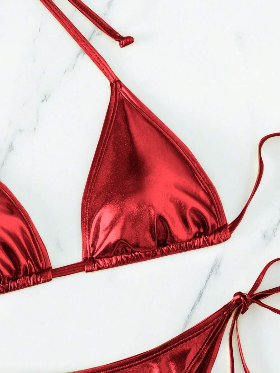 Women's two-piece halter triangle bikini set featuring tie-side high-waist bottoms and tie-back top.