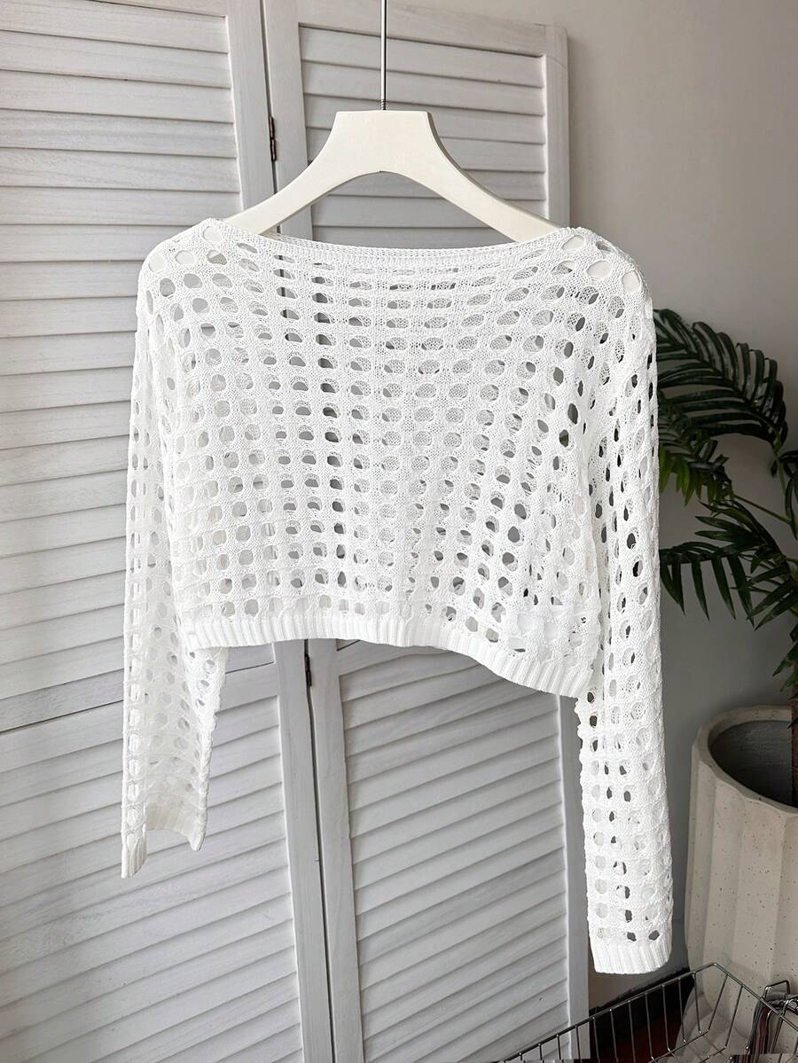 White tween girls beach cover up with cut out details, boat neckline, long bell sleeves, regular length knitwear design, and medium stretch viscose fabric.
