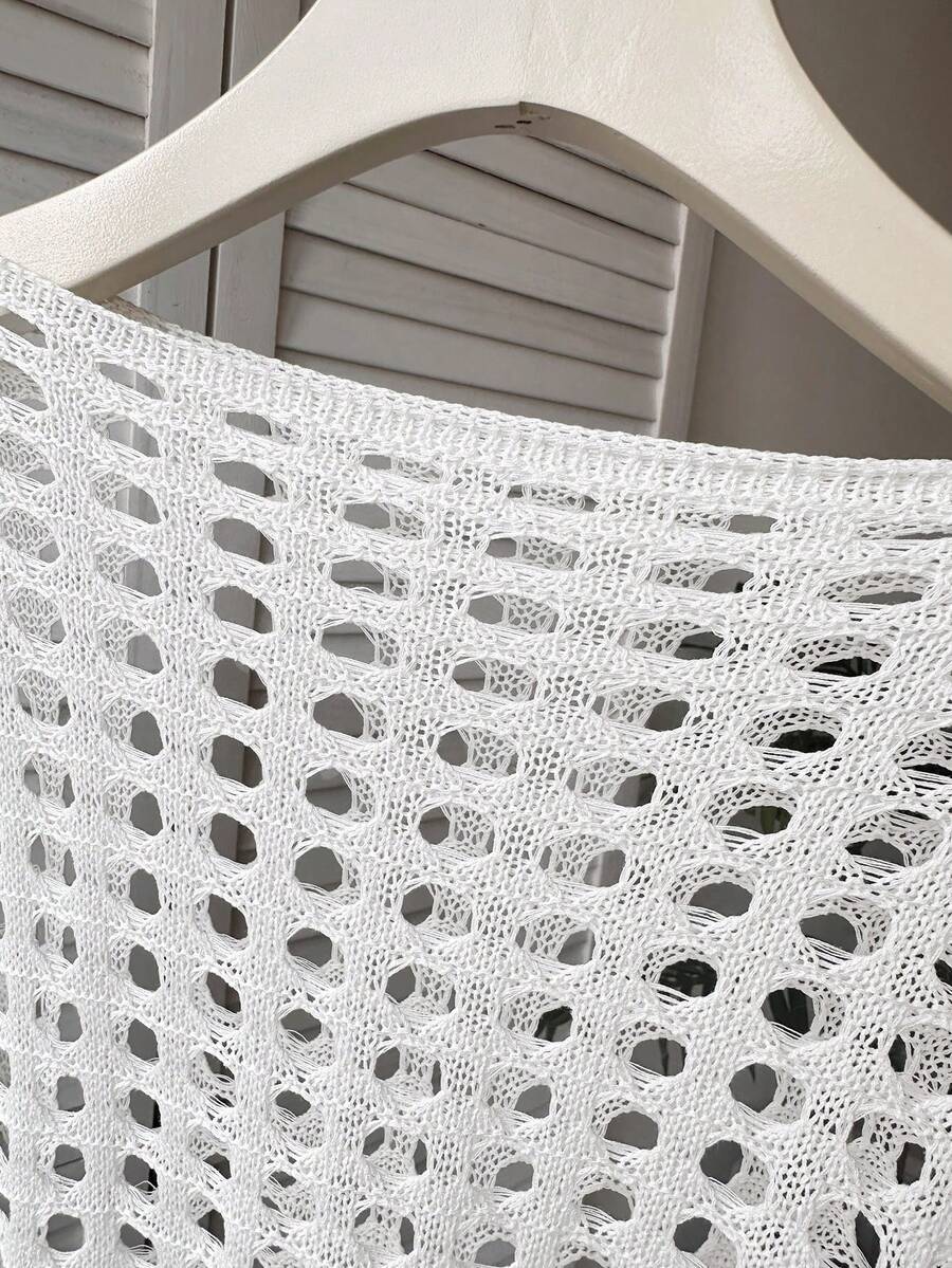 White tween girls beach cover up with cut out details, boat neckline, long bell sleeves, regular length knitwear design, and medium stretch viscose fabric.