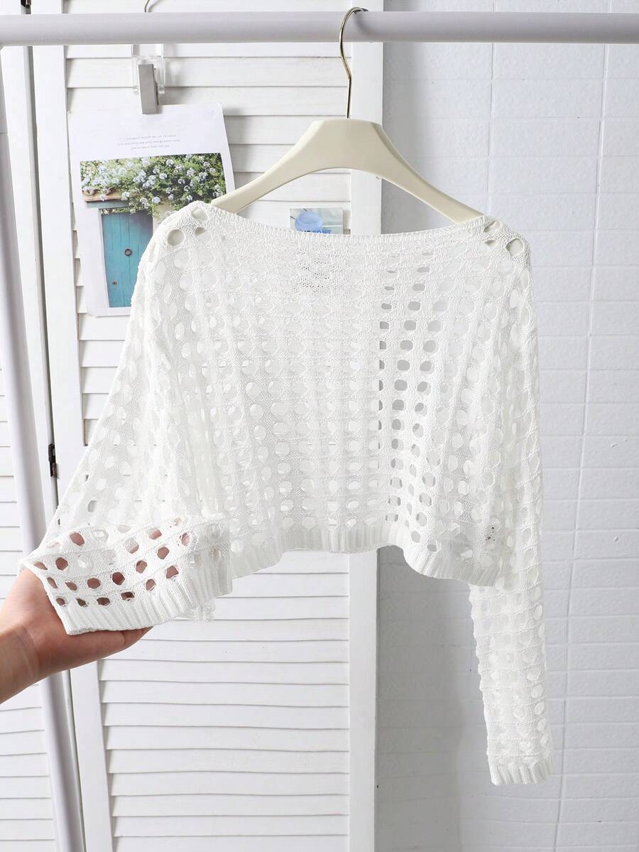 White tween girls beach cover up with cut out details, boat neckline, long bell sleeves, regular length knitwear design, and medium stretch viscose fabric.